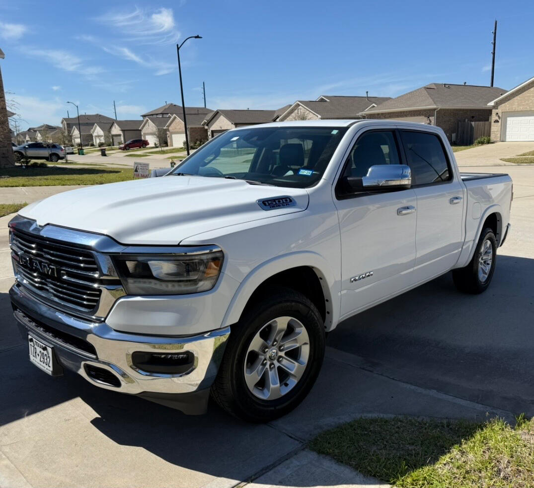 The white Ram pickup that represents The White Renovation Truck